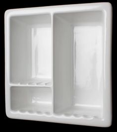 a white wall mounted shelf with two compartments