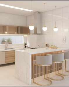 a modern kitchen with marble counter tops and stools