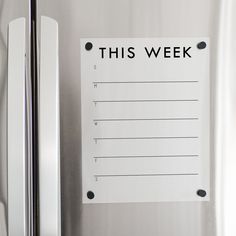 this week is written on a refrigerator door