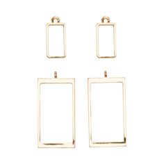 three square earrings in gold tone with two smaller squares hanging from the front and one small square