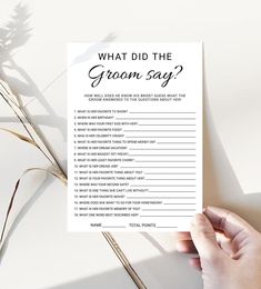 someone holding up a printable question card with the words, what did the groom say?