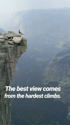 a man standing on the edge of a cliff