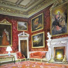 a painting of a living room with paintings on the wall