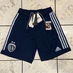 Let Your Sporting Kansas City Pride Shine Wherever You May Be By Grabbing These Sweet Shorts From Adidas. Along With A Comfortable Elastic Waistband, These Shorts Offers Moisture-Wicking Aeroready Technology To Keep You Fresh And Focused. On Top Of That, The Striking Sporting Kansas City Graphics Let Everyone Know You're A Devoted Fan. Soccer Shorts, Sporting Kansas City, Adidas Shorts, Adidas Sport, Shorts Men, Blue Adidas, Shorts Athletic, Adidas Men, Kansas City