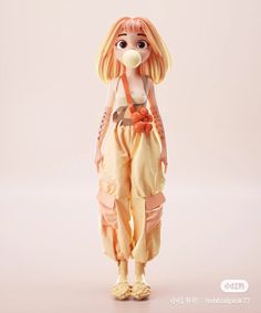 a doll with blonde hair is standing in front of a white background