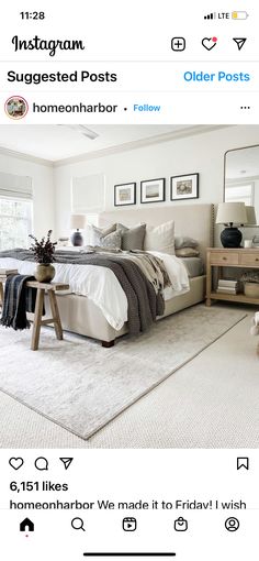 a bed room with a neatly made bed and pictures on the wall