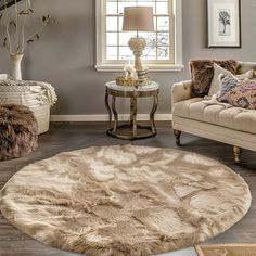 a living room filled with furniture and a rug