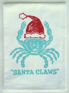 a towel with a crab wearing a santa hat