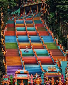 colorfully painted steps leading up to the top of a hill