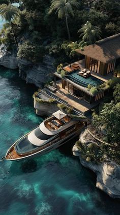 an aerial view of a boat in the water near a house and beach with trees