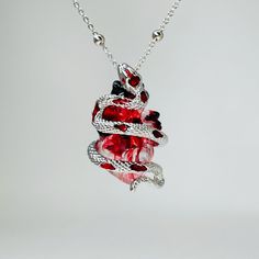 Snake necklace - Bloody snake necklace - heart necklace chain- snake pendant charm - Bloody heart Necklace -Gothic-Bloody jewelry Size: 3.2 cm Material: Snake :alloy and silver two Material could be choose Heart: Resin The red color in the middle of the heart is artificial plasma, and the flow effect cannot be exactly the same as the picture. Red And Silver Jewelry, Snake Outfit, Snake Accessories, Snake Heart, قلادات متدلية, Heart Resin, Couple Necklace, Edgy Jewelry, Necklace Gothic