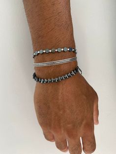 Three different handmade bracelets that are made from hematite and metal beads. A unique round beaded bracelet, a silver bangle that is made from sterling silver 925 and the last bracelet has bar beads that are passed through a black cord. You can wear them together or separetely as well. In Christina Christi Jewels store you can see more than 100 designs in Men's Bracelets. You can have them in 2-4 Days with DHL EXPRESS SHIPPING MATERIALS - Hematite Beads. - Metal Beads. - Round Beads are passe Adjustable Gunmetal Metal Bracelets, Adjustable Gunmetal Metal Bracelet, Hand-strung Metal Bracelets With Round Beads, Stackable Metal Bracelets With Round Beads, Stackable Metal Beaded Bracelets With Round Beads, Stackable Beaded Bracelets With Round Metal Beads, Adjustable Hematite Bracelet With Silver Beads, Stackable Metal Beaded Bracelets, Adjustable Hematite Jewelry With Silver Beads