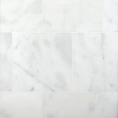 a white marble tile wall that looks like it has been cleaned