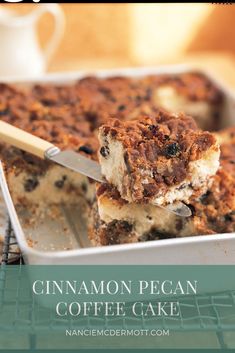 cinnamon pecan coffee cake on a cooling rack with a spatula in the foreground