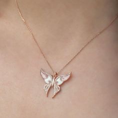 The presence of a white butterfly indicates that your guardian angels are looking out for you. As a sign that you're on the right track, it's important to maintain it that way. It also signifies that the spirit of a loved one who has passed away watches over you and provides protection. • Finish: 925k Sterling Silver / Rose • It's dainty and can be worn every day • A special piece you'll treasure • High quality materials and attention to detail • Our jewelry is designed With 🖤️ In NY H O W ∙ T Elegant Butterfly Shaped Jewelry With Adjustable Chain, Rose Gold Butterfly Necklace With Adjustable Chain, Feminine Rose Gold Jewelry With Adjustable Chain, Elegant White Sterling Silver Butterfly Necklace, Elegant Butterfly Jewelry As A Gift For Her, Elegant Butterfly Jewelry Gift For Her, Feminine White Gold Necklace For Gift, Feminine White Gold Necklace Gift, Elegant Personalized Pink Necklace