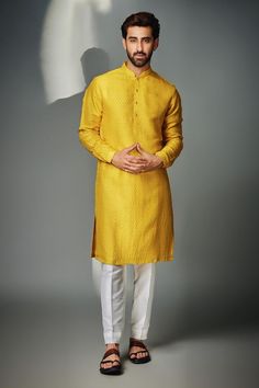 Mustard kurta with hexagon self patterns. Comes with contrast pyjama pant.
Components: 2
Pattern: Textured
Type Of Work: Self Design
Neckline: Mandarin
Sleeve Type: Straight Full
Fabric: Kurta : Silk Blend, Pyjama : Cotton Silk
Color: Yellow
Other Details: 
Front button placket
Occasion: Mehendi and Puja - Aza Fashions Yellow Kurta, Gents Kurta, Kurta Men, Hexagon Pattern, Ivory Silk, Kurta With Pants, Self Design, Silk Pants, Fashion App