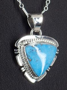 "This lovely sterling silver necklace features a beautiful piece of Kingman turquoise surrounded by sterling silver. This gorgeous necklace was handmade by Navajo artist, Larson L. Lee. This charming pendant measures 0.9\" inches tall with a 1.2\" inch hang, and 0.5\" inches wide. The weight of the necklace is 7 grams. Signed by the artist on the back, Larson L Lee, Sterling. Strung on a lovely 18\" inch Sterling Silver chain, this necklace makes a wonderful gift to yourself or others! Buy Authe Artisan Sterling Silver Turquoise Necklace Nickel Free, Artisan Turquoise Necklace In Sterling Silver, Nickel Free, Southwestern Turquoise Necklace With Sterling Silver Clasp As Gift, Southwestern Turquoise Sterling Silver Necklace, Southwestern Sterling Silver Teardrop Turquoise Necklace, Southwestern Sterling Silver Turquoise Necklace With Large Pendant, Untreated Turquoise Pendant Necklace In Sterling Silver, Untreated Blue Turquoise Sterling Silver Necklace, Untreated Blue Turquoise Necklace In Sterling Silver