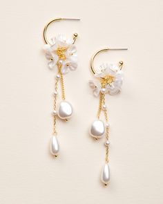 "MORENA DANGLE EARRINGS  Our Morena Dangle Earrings are designed to be one-of-a-kind floral dangle hoops that will have everyone asking \"where did you get those?!\" Crafted with off white flower clusters & dangling freshwater pearl beads, these earrings are perfect for casual or formal wear. DETAILS * Freshwater pearls, off white flowers, & pearl-like beads * Measures 1\" x 3.25\" length * Hypoallergenic, lead-free & nickel-free * Style #4389 SHOP MORE STYLES https://www.etsy.com/shop/darethcol White Hoop Earrings For Pierced Ears For Celebration, Pearl White Dangle Bridal Earrings, White Drop Earrings For Celebration, White Pearl Drop Jewelry For Marriage, Elegant White Hoop Earrings For Celebration, Elegant White Flower Earrings For Celebration, Dangle Pearl Drop Flower Earrings For Anniversary, Pearl Drop Dangle Flower Earrings For Anniversary, White Pearl Drop Clip-on Earrings For Anniversary