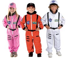 three children in astronaut costumes standing next to each other