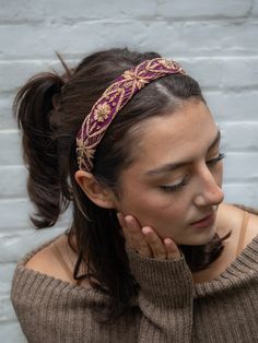 This limited-edition headband is handmade with ornate gold filigree embroidery and a soft vegan suede lining. The ends are capped off with soft velvet ribbon. The quality and rarity of the embroidery make these true hair couture! They are created from antique hand embroidery of gold thread on a silk crepe base. The handwork is extraordinary. Actual gold was used in these threads. Because they are pre-used and antique they are not expected to be perfect, but the “flaws” are patina, not faults. - Traditional Embroidered Wedding Headpiece, Traditional Headband For Party, Festive Adjustable Crown-shaped Headband, Festive Adjustable Crown Headband, Handmade Ceremonial Headband, Bohemian Festive Headband, Traditional Gold Headband Headpiece, Traditional Handmade Headband, Adjustable Hair Accessories With Matching Headband For Festive Occasions