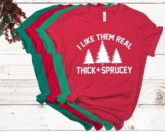 "Funny \"Real\" Christmas tree humor with this I Like Them Real, Thick + Juicy T-shirt. This listing is for 1 Adult Unisex crewneck t-shirt in colors- Heather Red, Canvas Red, Kelly Green, Heather Green, Athletic Gray, White or Black shirts (Colors are shown in listing photos). Lettering Vinyl colors are Red, Green, Black or White. To Order: 1. Choose size and vinyl color from the drop down menu 2. Choose your shirt color. 3. Add to cart **For multiple shirts-repeat this process if different siz Christmas Tree Humor, Dental Shirts, Funny Christmas Tree, Elf Shirt, Real Christmas, Christmas Party Shirts, Real Christmas Tree, Tee Tree, Gifts For Dentist