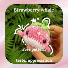 a hand holding a small crocheted animal with the words strawberry whale free pattern and tester appreciation