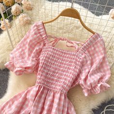 Gingham midi dress with a square neckline, short puff sleeves and a stretchy smocked bodice. Flowy tiered skirt with a big hem. Perfect for picnic days! S: 27"-40" chest, 22"-35" waist, 43" lengthM: 28.5"-41.5" chest, 23.5"-36.5" waist, 43" lengthL: 30"-43" chest, 25"-38" waist, 43" length Gingham Dress With Smocked Bodice And Short Sleeves, Gingham Short Sleeve Dress With Smocked Bodice, Short Sleeve Gingham Dress With Smocked Bodice, Fitted Gingham Smocked Dress With Short Sleeves, Short Sleeve Gingham Smocked Dress For Summer, Cottagecore Puff Sleeve Dress With Square Neck And Ruffles, Short Sleeve Gingham Smocked Dress, Gingham Dress With Ruffle Hem And Square Neck, Square Neck Dress With Ruffle Hem For Picnic