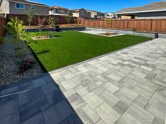 the backyard is clean and ready to be used as an outdoor space for people to play in