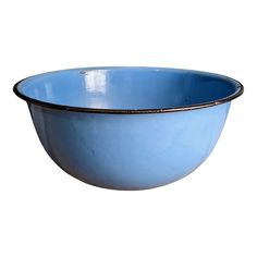 a blue bowl with black rim on a white background