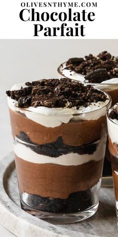 chocolate parfait desserts in glass dishes on a marble platter with text overlay