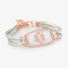 Our Luminous SmartSize Medic Alert Bracelet features our Coastal Flat Medical ID Tag in Mother of Pearl and Gold. This eye-catching, engravable med ID tag is finished with dual strands of cream pearlescent genuine leather and touches of gold tones. Made with a one inch of adjustable chain, Luminous can be worn as snug or loose as you prefer. The nature of the mother of pearl inlay requires the med ID tag to be flat and not curved.

With custom engraving, this women's medical alert bracelet is a Medical Alert Jewelry, Interchangeable Bracelet, Medical Id Bracelets, Multiple Bracelets, Medic Alert Bracelets, Medical Bracelet, Medical Alert, Id Bracelets, Bracelets For Women