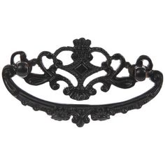 an ornate black iron cabinet pull handle