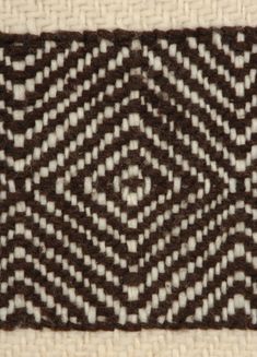 a brown and white woven piece of cloth