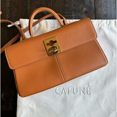 Cafune Stance Wallet Color: Chestnut Detachable/ Adjustable Strap 100% Authentic. Purchased From Cafune Website. In Gently Used Condition Comes With Dust Bag And All Original Packing Cards & Tissue Paper. Can Also Send Receipt Upon Request. From Website: Details Premium Italian Cow Leather Signature C-Lock Clasp Lock Detachable Adjustable Shoulder Strap Internal And Back Zip Pockets Internal Bill And Card Slots Black Recycled Polyester Lining Gold Hardware Currently Retailing For $448+ Tax On Website. Open To Resonable Offers Chic Brown Crossbody Wallet, Chic Brown Rectangular Wallet, Chic Everyday Brown Wallet, Brown Rectangular Wallet With Detachable Strap, Brown Wallet With Detachable Strap, Brown Wallet With Detachable Strap For Everyday, Brown Wallets With Detachable Strap, Luxury Brown Wallets For Office, Luxury Brown Wallets