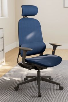 a blue office chair sitting on top of a rug