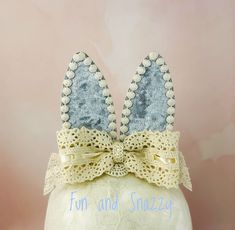 Beautiful French blue bunny ears topped with an exquisite ivory lace bow. The bunny ears come on a matching elastic headband or a hard headband. The bunny ears are 4'' tall. See other BUNNY EARS from our shop: https://www.etsy.com/shop/FunNSnazzy?ref=seller-platform-mcnav§ion_id=40720151 IMPORTANT NOTE Headbands may contain small parts. Children should always be supervised while wearing this or any other headband. Once the product is in your hands you are responsible for proper use. We take pride in our unique designs, and our quality. We take time to do things right & use high quality materials. We believe that our customers deserve to be buying the very best that we have to offer. All products are hand made in our smoke free, pet free studio! Boutique Quality Items Proudly Made in the US Baby Bunny Ears, Birthday Bunny, Ladybug Theme, Beautiful Hair Accessories, Hard Headbands, Blue Bunny, Elastic Headband, The Bunny