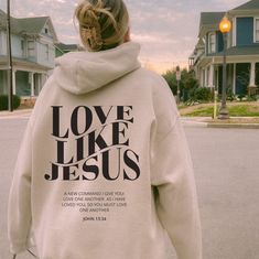 "Embrace the warmth of faith with our \"Love Like Jesus\" Christian hoodie. This cozy garment serves as a daily reminder to embody the compassion and kindness exemplified by Jesus. Featuring a timeless verse, this hoodie encourages you to carry the message of love wherever you go, wrapping you in the comforting embrace of both scripture and style. This unisex heavy blend hooded sweatshirt is relaxation itself. Made with a thick blend of cotton and polyester, it feels plush, soft and warm, a perf Inspirational Hooded Fall Sweatshirt, Inspirational Hooded Sweatshirt For Fall, Inspirational Letter Print Hoodie For Fall, Inspirational Hooded Hoodie With Letter Print, Inspirational Long Sleeve Hoodie For Fall, Inspirational Cotton Hoodie For Winter, Inspirational Fall Streetwear Hoodie, Inspirational Cotton Winter Hoodie, Inspirational Hoodie For Fall Streetwear