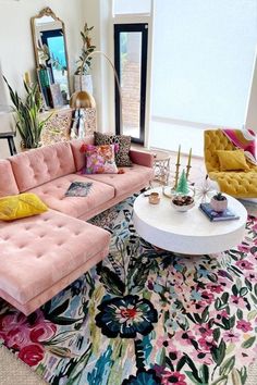 a living room filled with lots of furniture and decor on top of a colorful rug