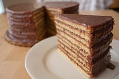 two slices of chocolate layer cake on a white plate