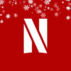 a red background with white snowflakes and the letter n on it's side