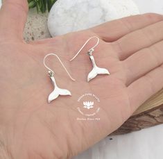 "Whale tail dangle Earrings, Mermaid Fish earrings, Surfer jewelry gift, Ocean Nautical jewelry, Scuba diving jewelry, Mermaid jewelry set, Whale tail jewelry Whale tale earrings in 925 sterling silver - no nickel - * Special Gift for Ocean Lovers* Average weight: 2.38g (one Pair) Width: 1.7 cm Length (including hooks) : 3 cm SHIPPING: We use Standard International Air Mail ** 7-10 working days for EUROPE and 7-20 working days WORLDWIDE For UK we use 2o Class \"Signed For\" 3-5 working days. If Sterling Silver Fish Hook Earrings, Sterling Silver Fish Hook Jewelry Gift, Sterling Silver Jewelry With Fish Hook For Gift, Whale Tail Jewelry, Silver Mermaid Tail, Surfer Jewelry, Ocean Inspired Jewelry, Silver Mermaid, Beach Earrings