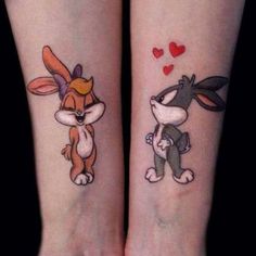 two tattoos on the legs of people with bunny and rabbit ears tattooed on their arms