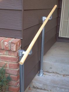 a wooden stick sticking out of the side of a house