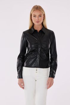 Cool and sleek, our Faux Leather Button-Up Shirt with Ruching Detail is designed with delicate ruching down the front for a subtle cinching that enhances its tailored silhouette. Crafted from plush vegan leather, it ensures a luxurious feel while bringing an edginess to any outfit. This leather shirt is also highly versatile and transitions seamlessly from a polished office look to casual elegance for after-work outings. Faux leather Ruching detail Button up Hand wash cold and line dry or dry cl Leather Button Up, Fur Top, Iconic Dresses, Office Look, Leather Shirt, Casual Elegance, Cool Suits, Leather Top, Denim Fashion