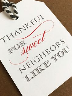 a thank card that reads, thank for sweet neighbors like you and two black and white twine