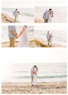 a man and woman standing on top of a beach next to the ocean holding hands