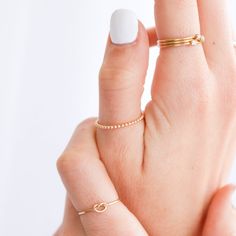 Dainty and delicate, the Love Me Knot Ring is one of the sweetest additions to our stacking kellection. Made to remember the ties to our loved ones, this beauty is the perfect gift for the special someone in your life or to permanently have your nearest and dearest close at hand. 14k Gold Filled Stackable Rings As Gift, Simple Design Gold Stackable Rings As Gift, 14k Gold Filled Dainty Everyday Rings, Dainty 14k Gold Filled Rings For Everyday, Delicate Hypoallergenic 14k Gold Midi Rings, Gold Filled Stackable Open Rings For Gifts, 14k Gold Filled Midi Rings With Simple Design, Dainty Hypoallergenic 14k Gold Filled Rings, Adjustable 14k Gold Midi Rings For Everyday