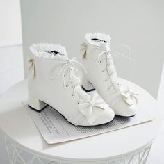 Fashion Lolita Bowtie Boots PN3713 ●Size:please see the picture. ●Heel Hight:about 3.5 cm ●Material:PU (Please allow 1-3cm differs due to manual measurement.As different computers display colors differently,the color of the actual may vary slightly from the above images.Thanks for your understanding.) ●About Shipping: We attach great importance to the orders of each customer and parcel delivery. 1.Processing time: 2-3 business days. 2.Shipping time: 10-15 business days to US, please allow 3-4 weeks shipping to other country.(Shipping times can be affected by variable customs clearance times or public holidays.) Cute White Boots For Fall, White Laced Boots For Spring, Cute White Lace-up Boots, White Lace-up Boots With Round Toe For Party, White Lace-up Winter Boots, White Lace-up Boots For Winter, Spring White Lace-up Boots With Flat Heel, White Flat Heel Lace-up Boots For Spring, Cute White Closed Toe Boots