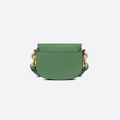 New this season, the Dior Bobby bag showcases sophisticated lines and harmonious proportions, here in micro format. The jade green silhouette is crafted from box calfskin with a suede interior for added suppleness, and is enhanced by antique gold-finish metal hardware. Its removable and adjustable sliding shoulder strap has a military-inspired buckle, and allows the miniature bag to be carried by hand, over the shoulder or crossbody.COMPOSITIONCalfskinProduct code:S5127UMOL_M69HSIZE GUIDE 12,5 x 10 x 4 cm Dior Bobby Bag, Green Silhouette, Bobby Bag, Military Inspired, Vuitton Bag, Jade Green, Casual Backpack, Metal Hardware, Green Bag