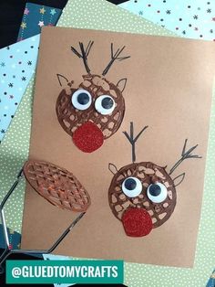 two reindeer made out of brown paper with googly eyes and antlers on them